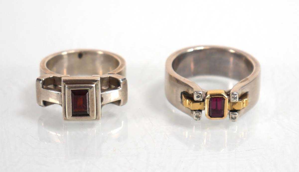 Lot 837 - A modern silver dress ring set pink stone and...