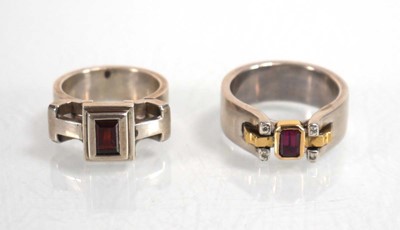 Lot 837 - A modern silver dress ring set pink stone and...