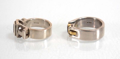 Lot 837 - A modern silver dress ring set pink stone and...