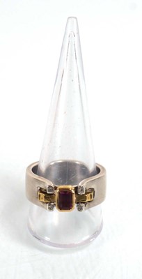 Lot 837 - A modern silver dress ring set pink stone and...
