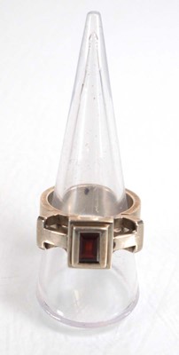 Lot 837 - A modern silver dress ring set pink stone and...