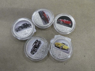 Lot 2462 - 5 Classic car collectable enamelled coins