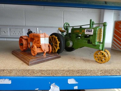 Lot 2532 - Two metal tractor figures, one John Deere, one...
