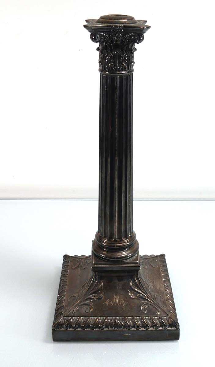 Lot 447 - An Edwardian silver candlestick of Corinthian...