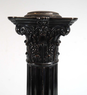 Lot 447 - An Edwardian silver candlestick of Corinthian...