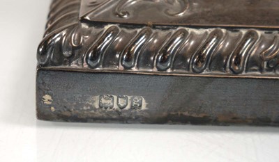 Lot 447 - An Edwardian silver candlestick of Corinthian...