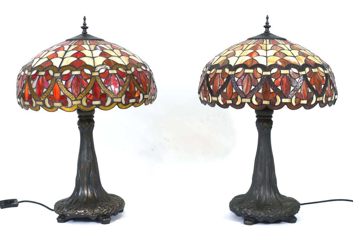 Lot 93 - A near pair of Tiffany style table lamps, each...