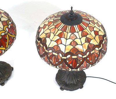 Lot 93 - A near pair of Tiffany style table lamps, each...
