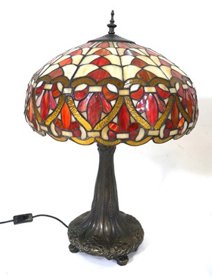 Lot 93 - A near pair of Tiffany style table lamps, each...