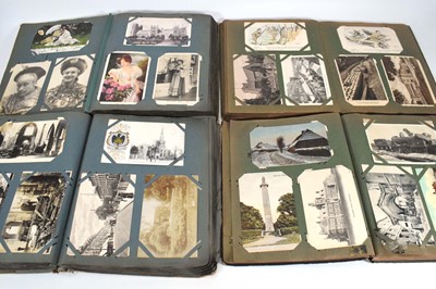Lot 124 - Seven albums of postcards including a train...