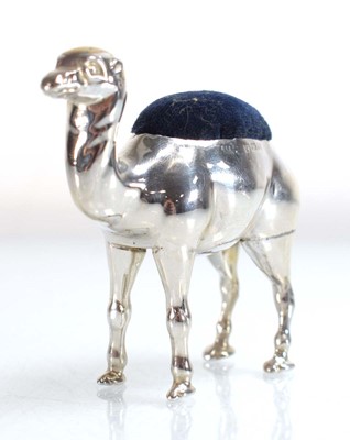 Lot A silver pin cushion modelled as a standing...