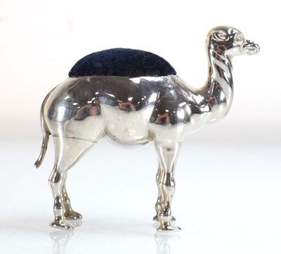 Lot A silver pin cushion modelled as a standing...