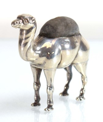 Lot A silver pin cushion modelled as a standing...