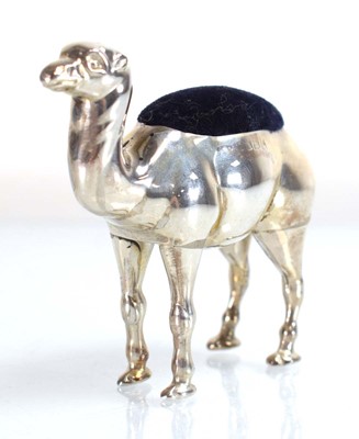 Lot A silver pin cushion modelled as a standing...
