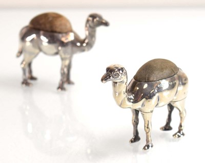 Lot Two silver pin cushions, each modelled as a...