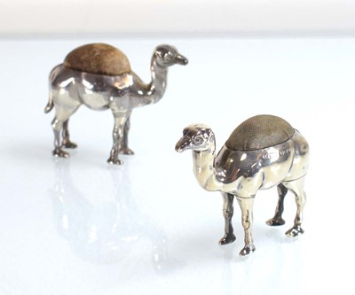Lot Two silver pin cushions, each modelled as a...