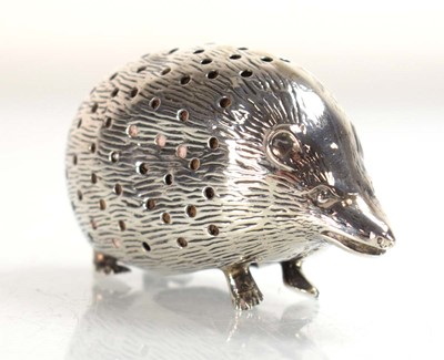 Lot A silver pin cushion modelled as a hedgehog,...