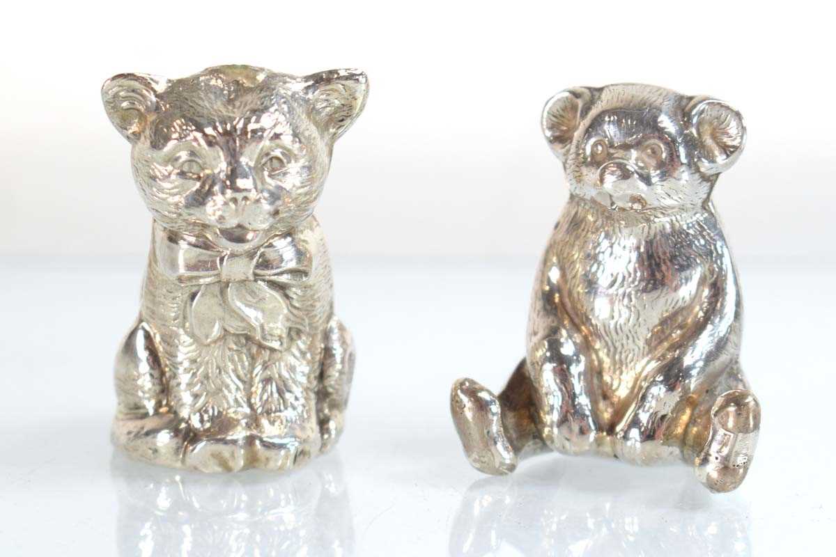 Lot A silver pin cushion modelled as a seated cat,...