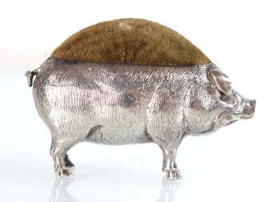 Lot A silver pin cushion modelled as a standing...