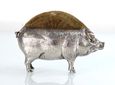 Lot A silver pin cushion modelled as a standing...