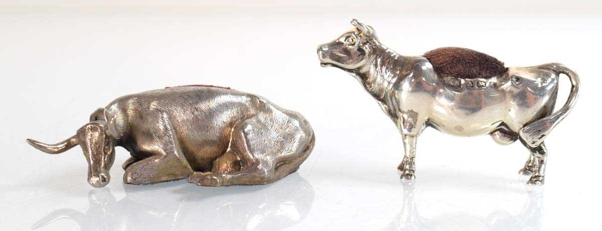Lot A silver pin cushion modelled as a standing...