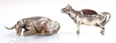 Lot A silver pin cushion modelled as a standing...
