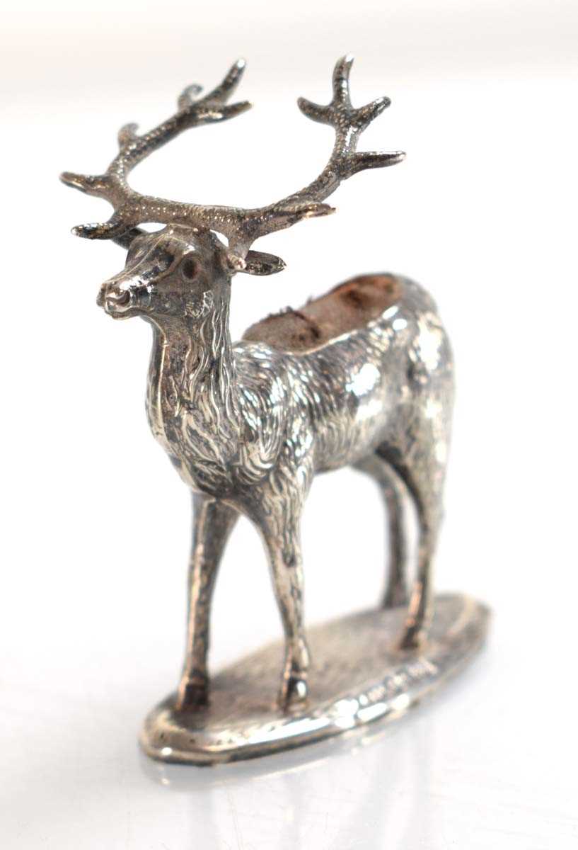 Lot A silver pin cushion modelled as a stag, Adie...