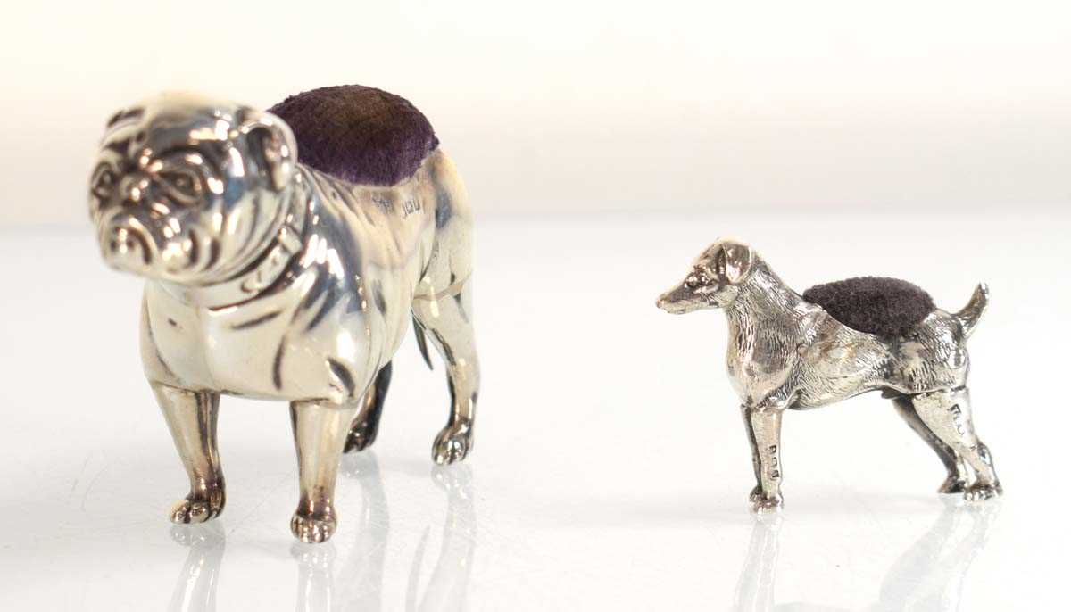 Lot A silver pin cushion modelled as a standing...