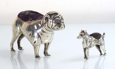 Lot A silver pin cushion modelled as a standing...