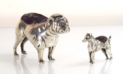 Lot A silver pin cushion modelled as a standing...