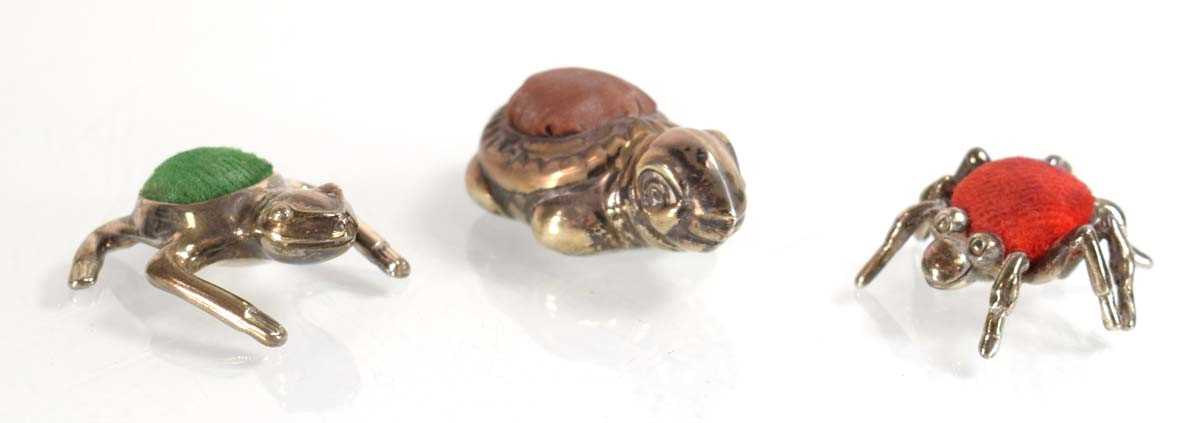 Lot A silver pin cushion modelled as a spider,...