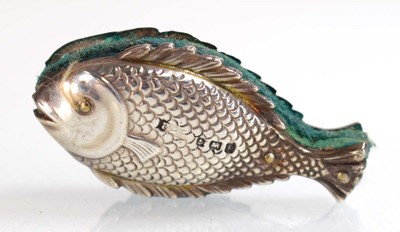 Lot A silver pin cushion modelled as a fish,...