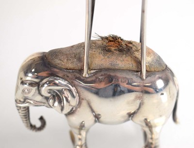 Lot A silver pin hat pin cushion modelled as a...