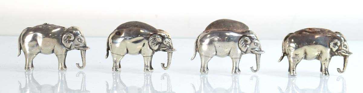 Lot Four silver pin cushions, each modelled as a...
