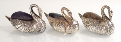 Lot Three silver pin cushions, each modelled as a...
