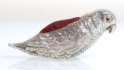 Lot A silver pin cushion modelled as a parrot,...