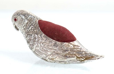 Lot A silver pin cushion modelled as a parrot,...