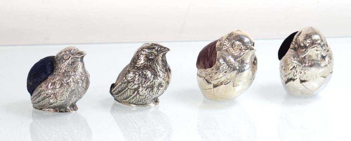 Lot A silver pin cushion modelled as a chick, Levi...