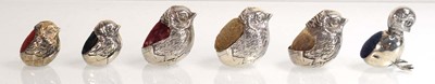 Lot A silver pin cushion modelled as a chick, Levi...