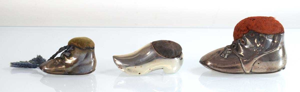 Lot A silver pin cushion modelled as a boot, Levi...
