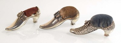 Lot A near pair of silver pin cushions, each...