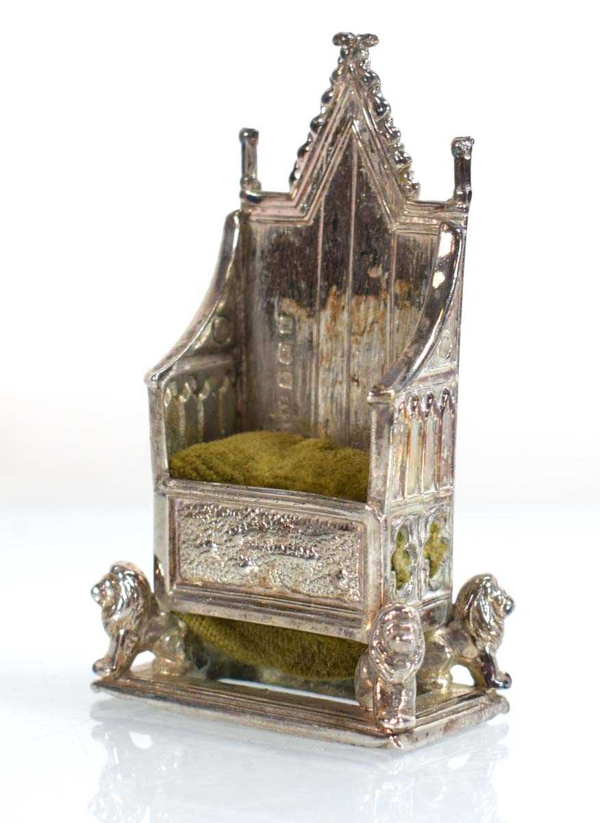 Lot A silver pin cushion modelled as the...