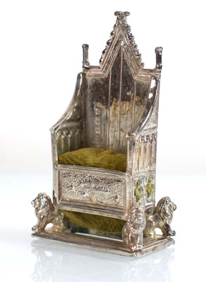 Lot A silver pin cushion modelled as the...