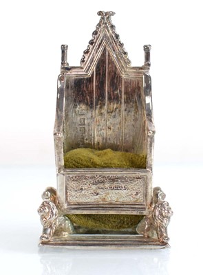 Lot A silver pin cushion modelled as the...
