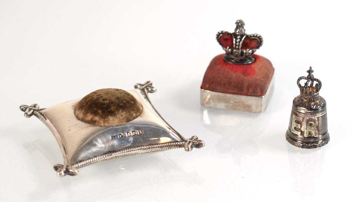 Lot A silver pin cushion modelled as the...