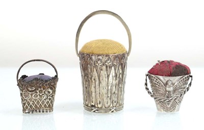 Lot A metalware pin cushion modelled as a basket...