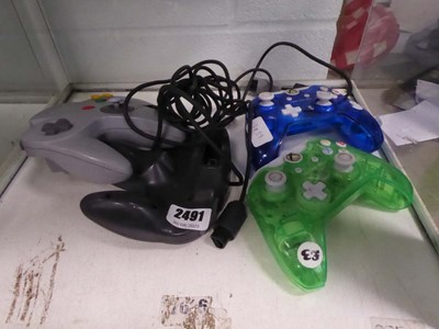 Lot 2491 - Two Rock Candy Xbox controllers & two Nintendo...