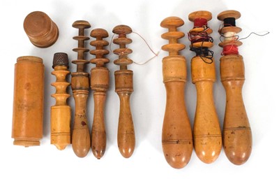 Lot 143 - A group of seven treen bobbins including one...