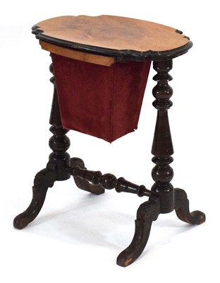 Lot 6 - A Victorian walnut sewing table, the...
