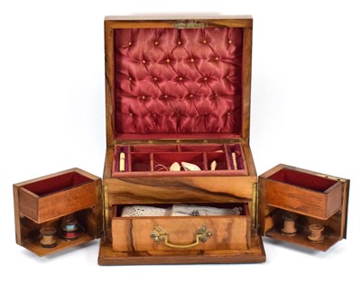 Lot 141 - A Victorian figured walnut sewing box with a...